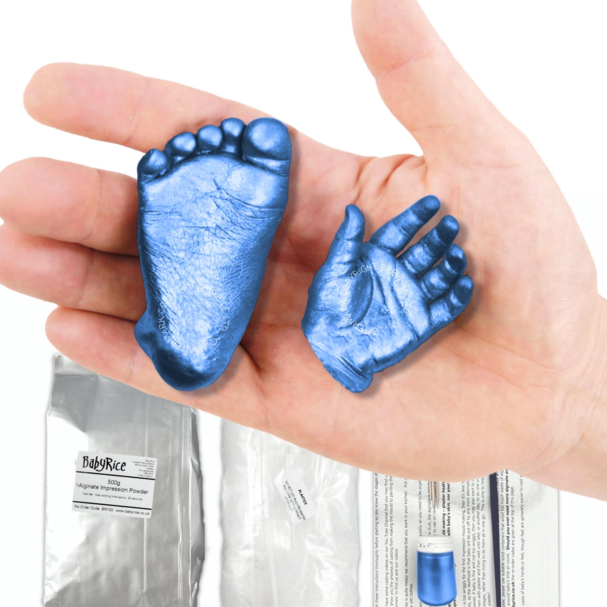 Close up of a baby hand cast finished with blue paint