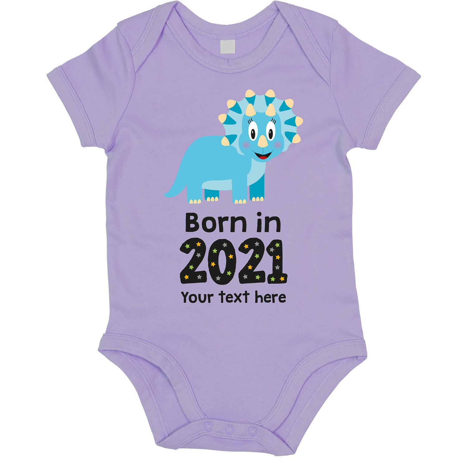 Anismalls Triceratops dinosaur character on a lavender coloured personalised bodysuit with born in 2021 text in black