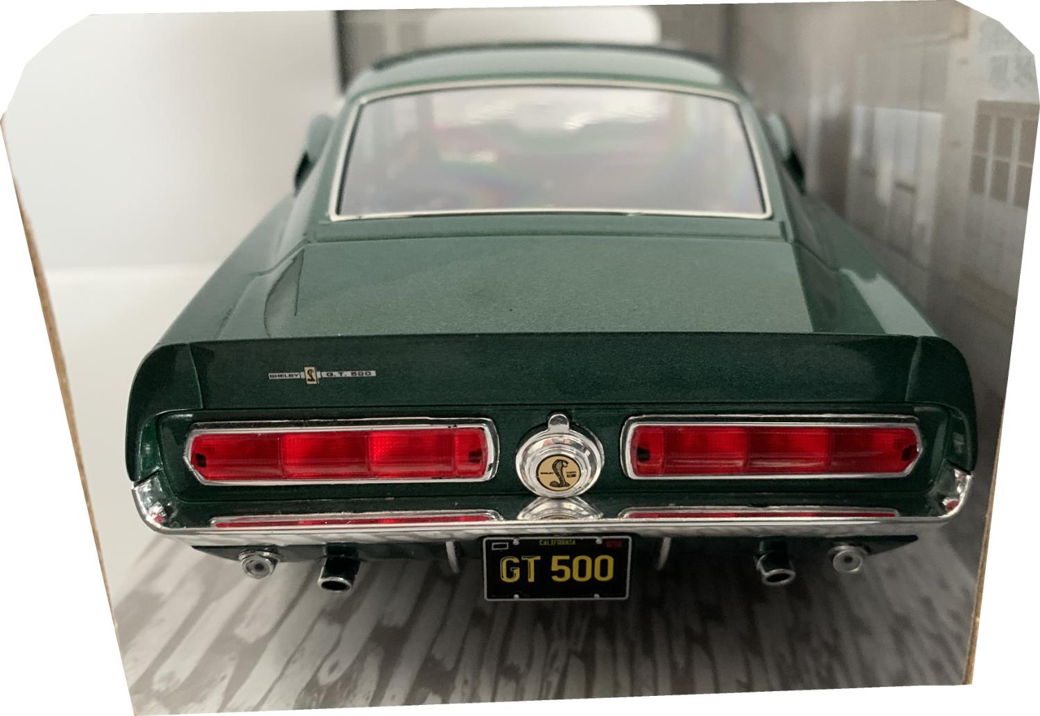 A very good representation of the Ford Shelby Mustang GT500 from 1967 decorated in dark highland green