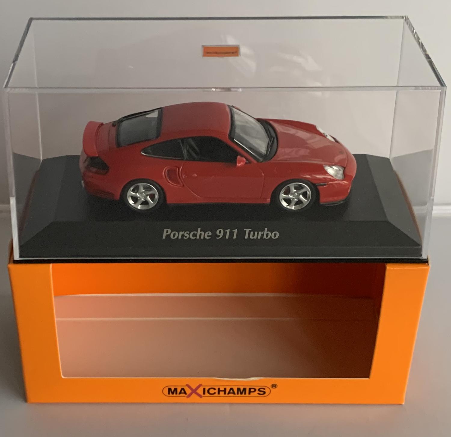 n excellent reproduction of the Porsche 911 Turbo with detail throughout, all authentically recreated.  Model is mounted on a removable plinth with a removable hard plastic cover and presented in Maxichamps  packaging