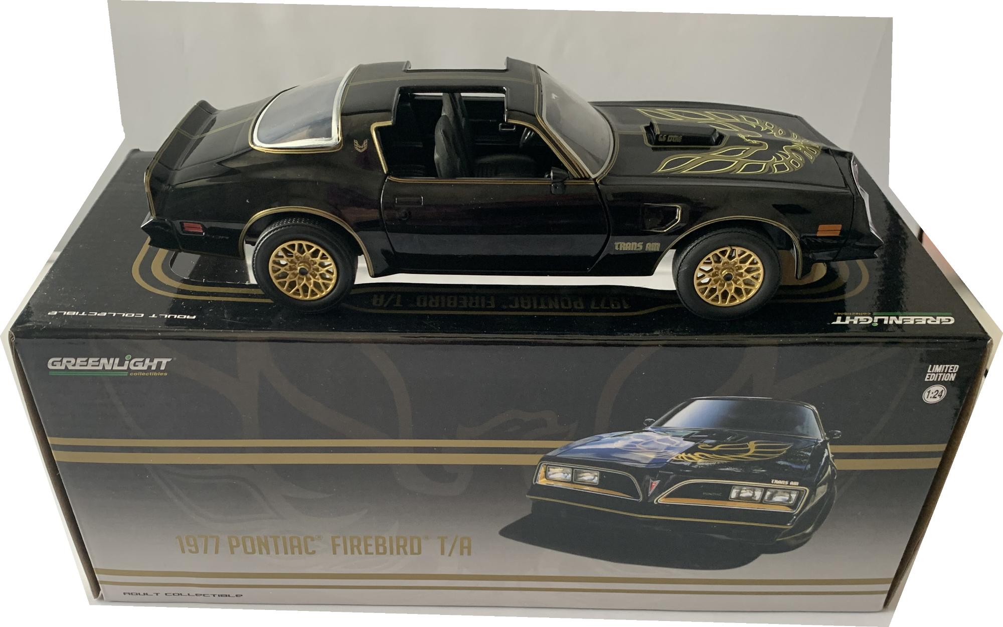 An excellent scale model of a Pontiac Firebird Trans Am decorated in black with authentic graphics including the eagle superbly replicated on the bonnet and gold wheels.  Other trims are finished in gold, orange and silver.  Features include opening driver and passenger doors with working wheels.