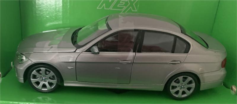 An excellent scale model of a BMW 330i decorated in metallic grey with silver wheels.