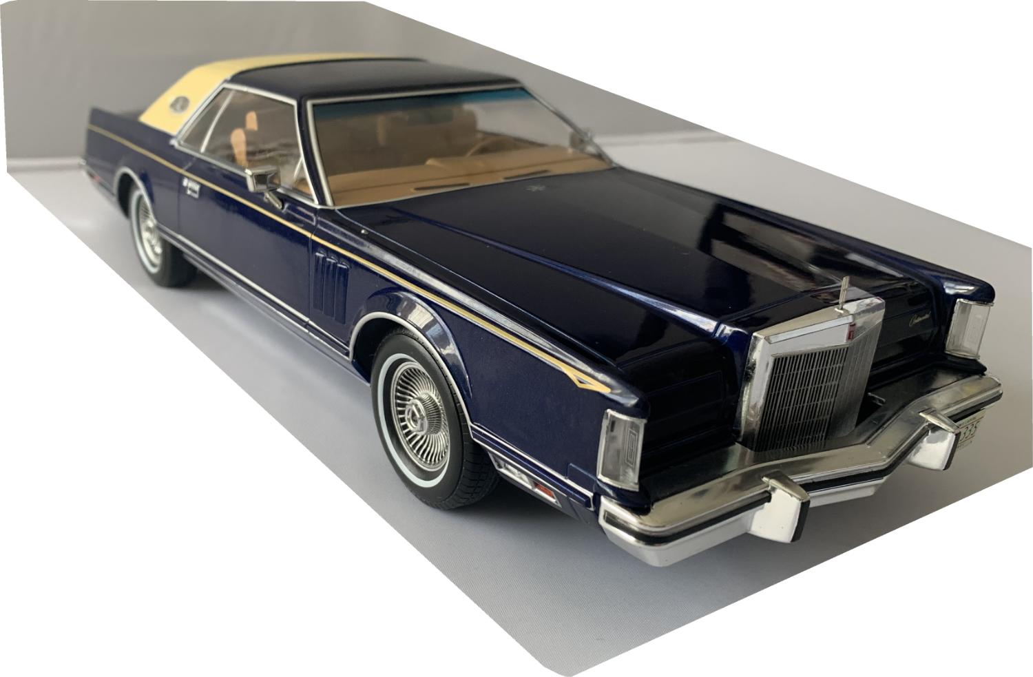 A very good representation of the Lincoln Continental mk5 decorated in blue and cream, fine coachlines, silver wheels with white rim tyres.