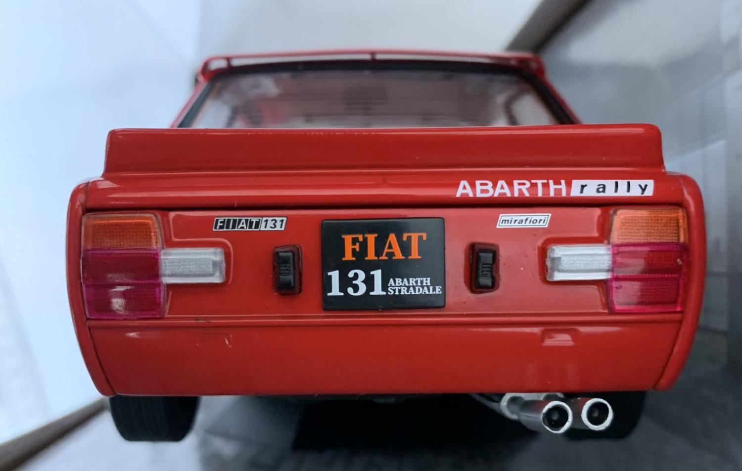 A very good representation of the Fiat 131 Abarth decorated in red with rear spoiler, bonnet air vent and dark grey wheels