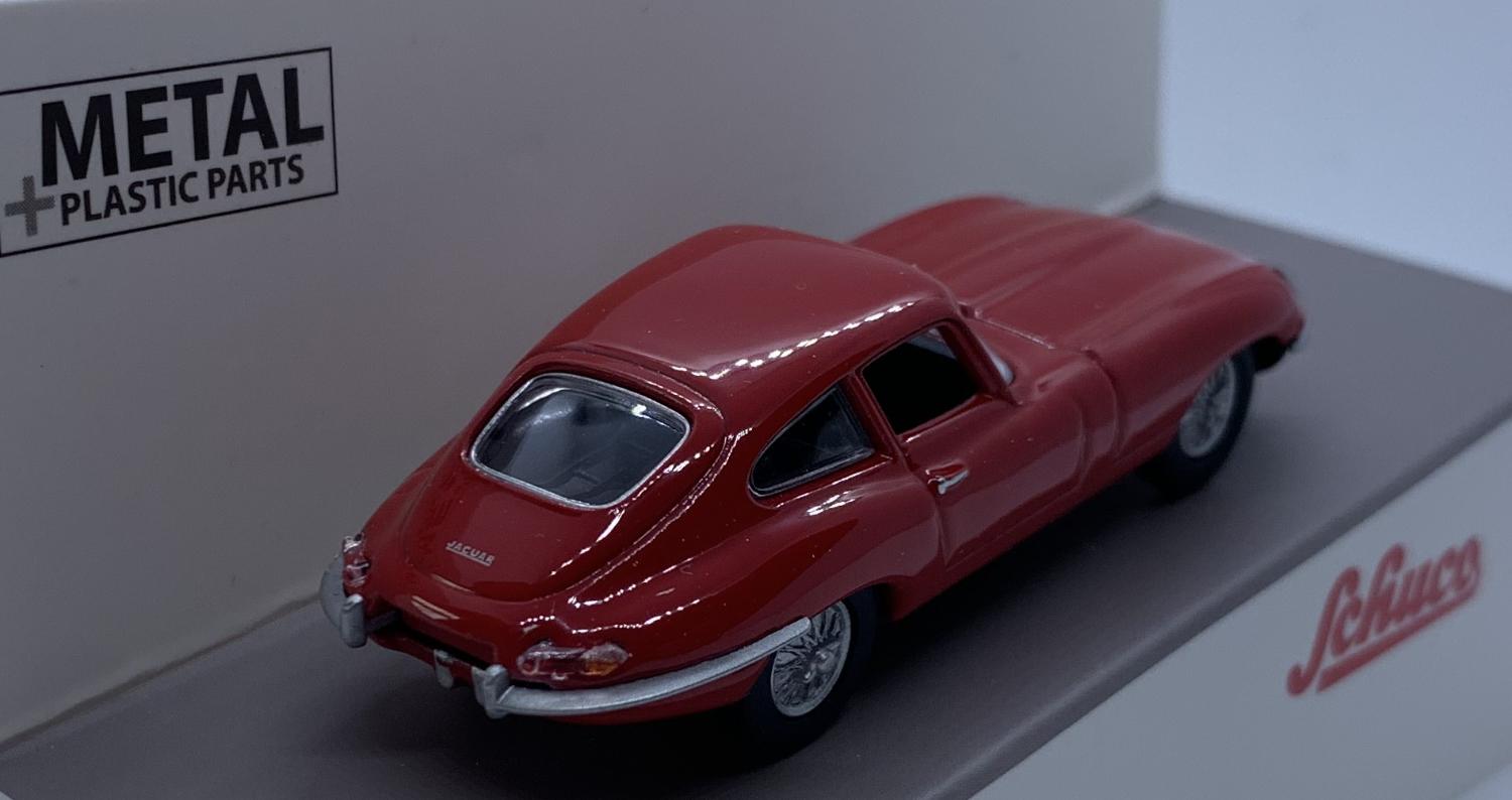 An excellent scale model of a Jaguar E Type Coupe decorated in red