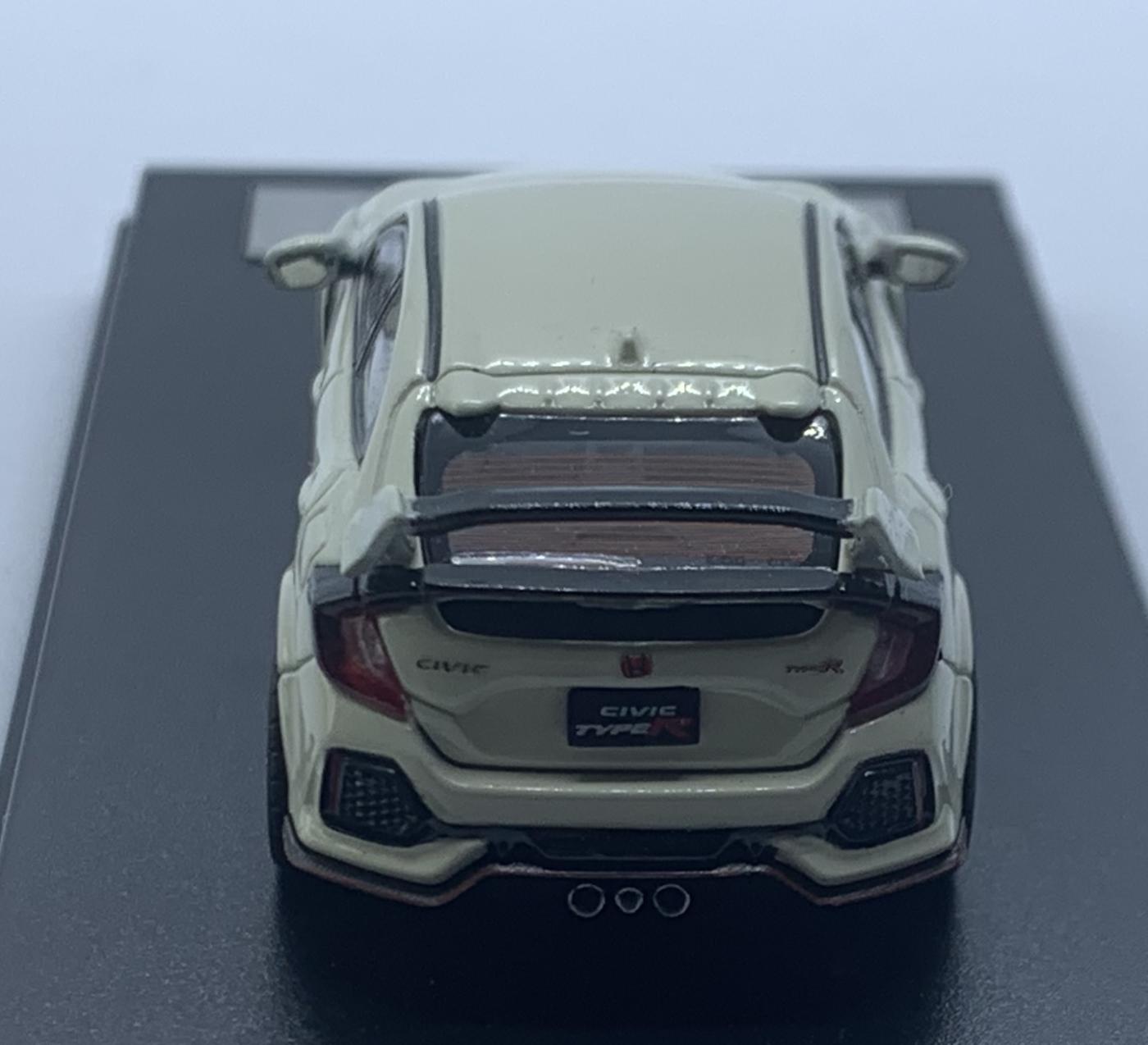 An excellent scale model of a Honda Civic Type R decorated in white with high rear spoiler and black wheels with red rims