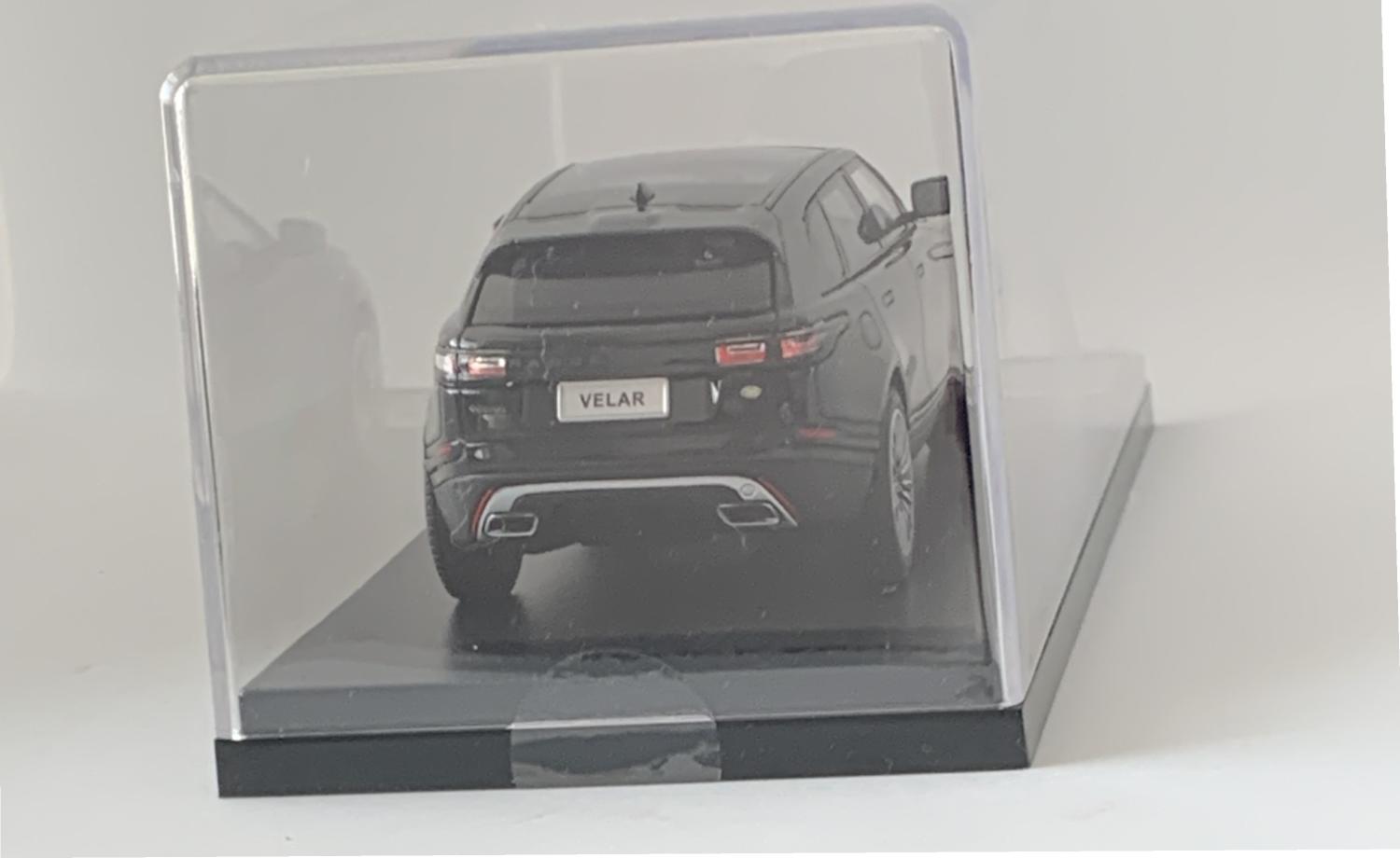 A very high quality accurate representation of the Land Rover Range Rover Evoque First Edition decorated in black with black panoramic roof, rear top spoiler with dark grey and silver wheels.