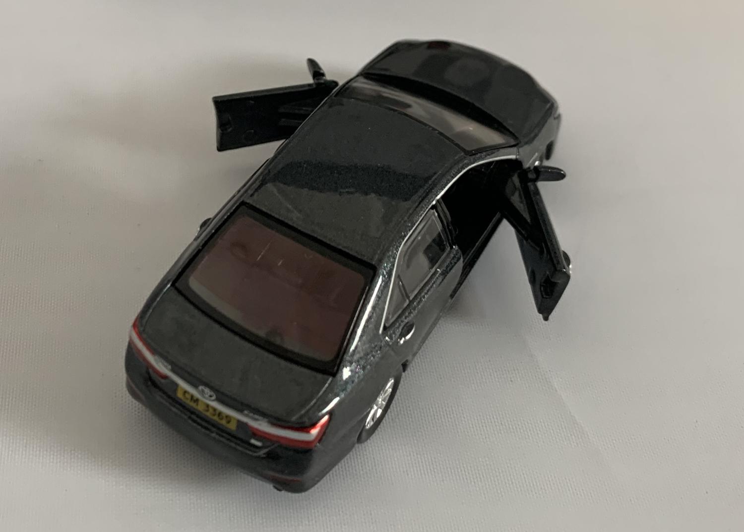 An excellent scale model of a Toyota Camry decorated in metallic grey with silver wheels.  Other trims are finished in black and silver.  Features include opening driver and passenger doors and working wheels.  The interior is finished in black with RHD steering wheel.