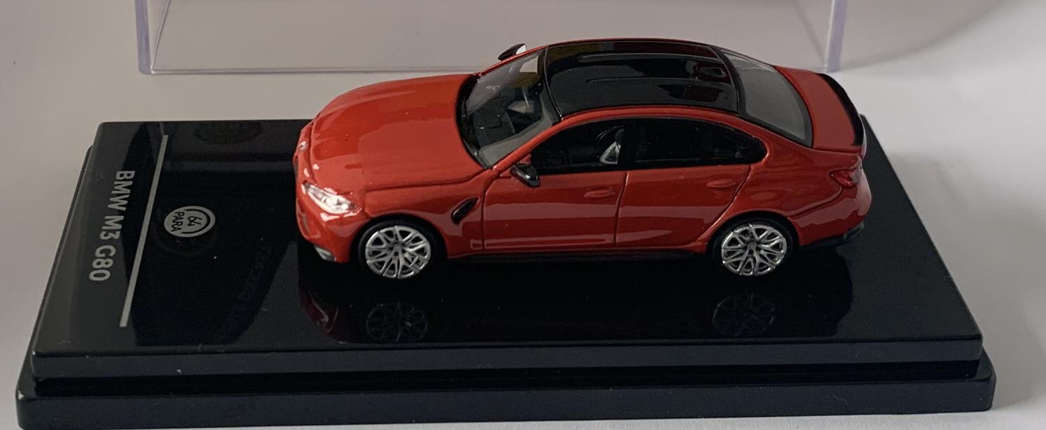 Details:  An excellent scale model of a BMW M3 G80 decorated in toronto red with black roof, rear spoiler