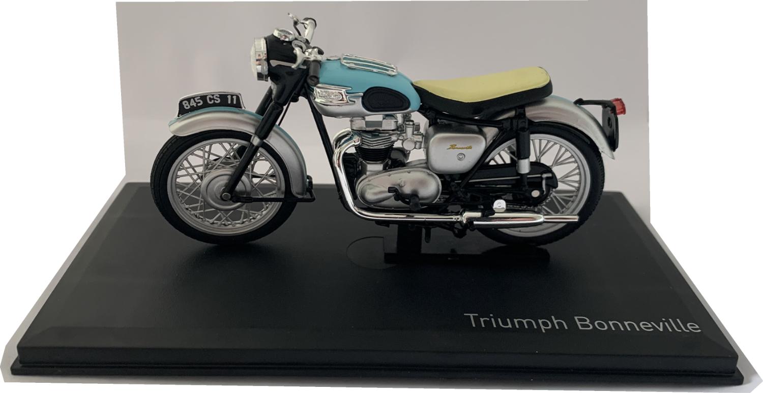 n accurate scale model of a 1959 Triumph Bonneville decorated in light blue and silver with silver spike wheels. Other trims are finished in chrome, black and silver. Features include moveable steering, instrument detail, working stand, rubber rolling wheels and real looking seat.