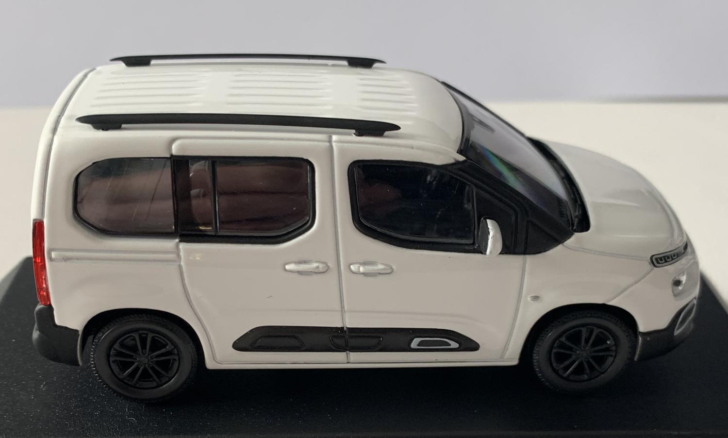An excellent scale model of a Citroen Berlingo decorated in white with black roof rails, tinted windows and black wheels.  Other trims are finished in black, chrome and white.
