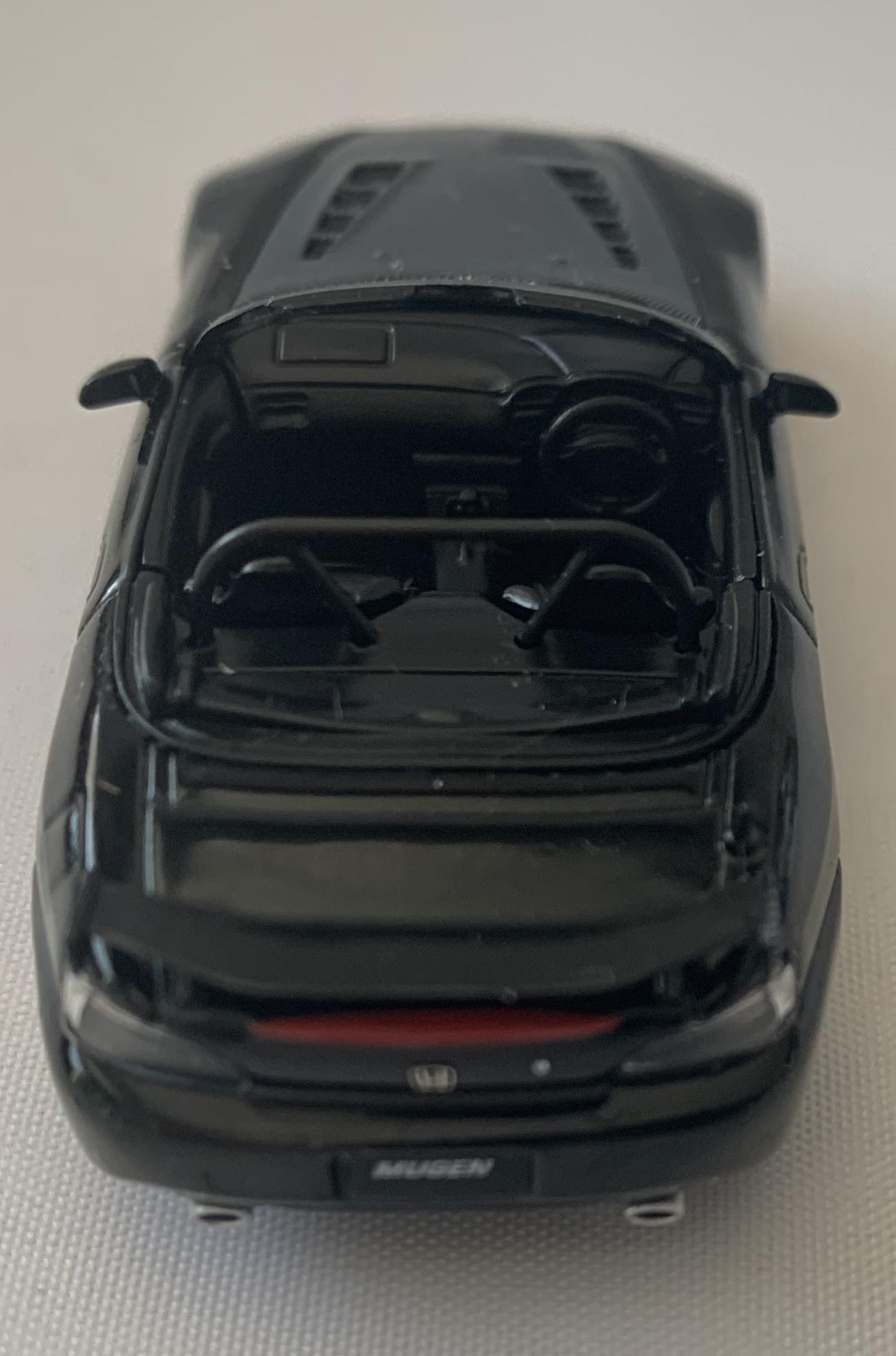 An excellent scale model of a Honda S2000 (AP2) decorated in berlina black with carbon effect bonnet and air vents, high rear spoiler and gold wheels