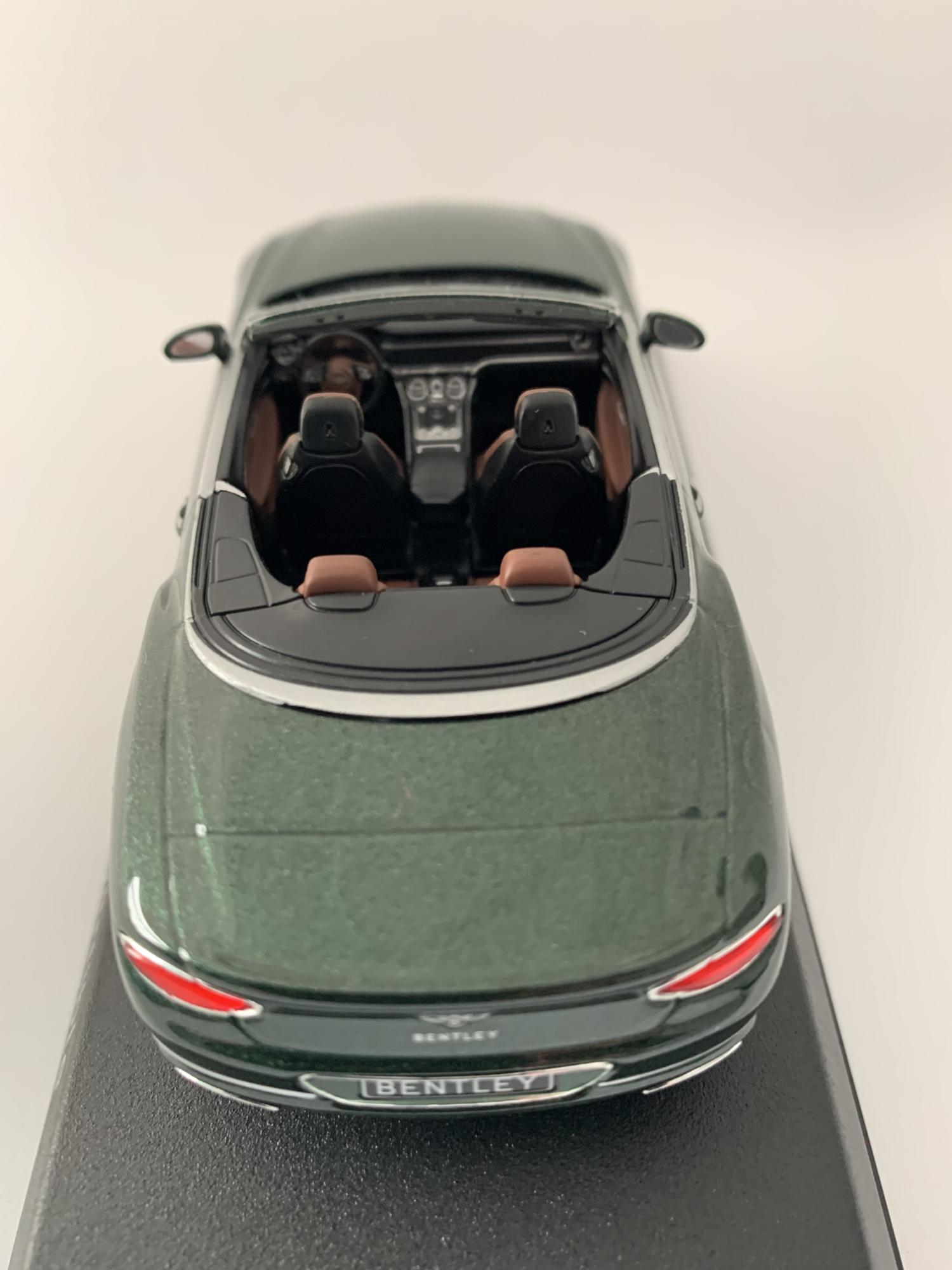 An excellent reproduction of the Bentley Continental GT Convertible with detail throughout, all authentically recreated. Model is mounted on a removable plinth with a removable hard plastic cover