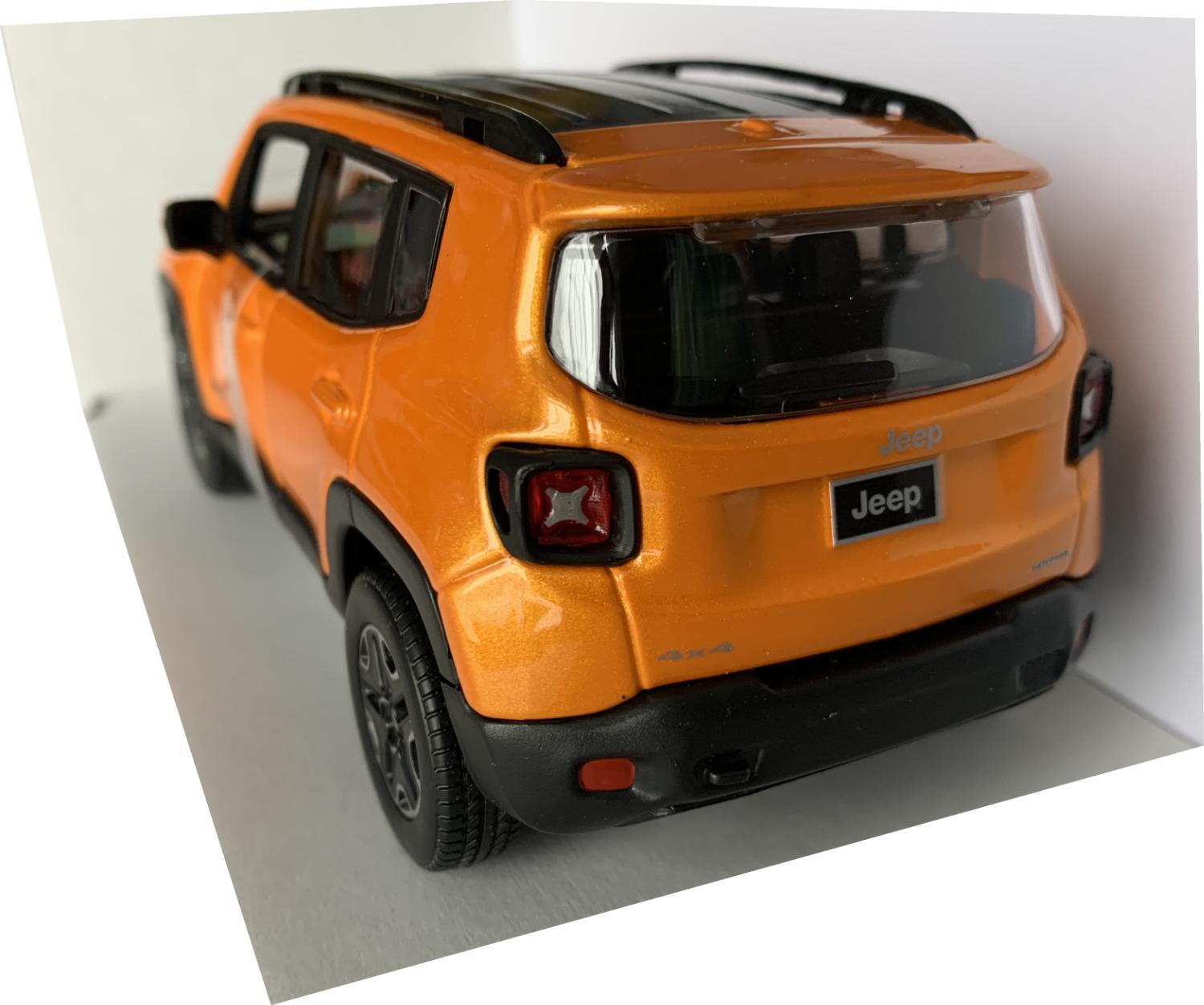 An excellent scale model of a Jeep Renegade decorated in orange with black roof, roof rails,