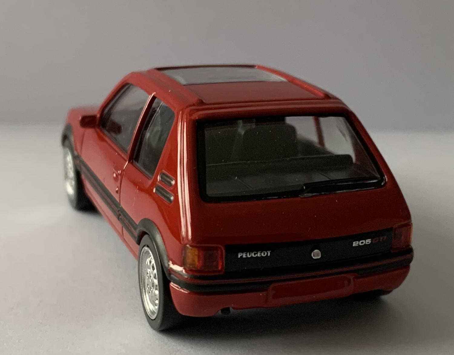 A good replica of the Peugeot 205 GTI decorated in vallelunga red with silver wheels.