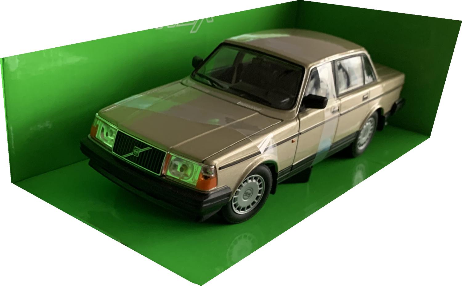An excellent scale model of a Volvo 240 GL decorated in gold with silver wheels