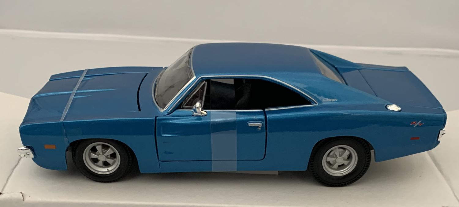 An excellent scale model of a Dodge Charger R/T decorated in bright blue with authentic graphics and silver wheels.  Features opening driver and passenger doors