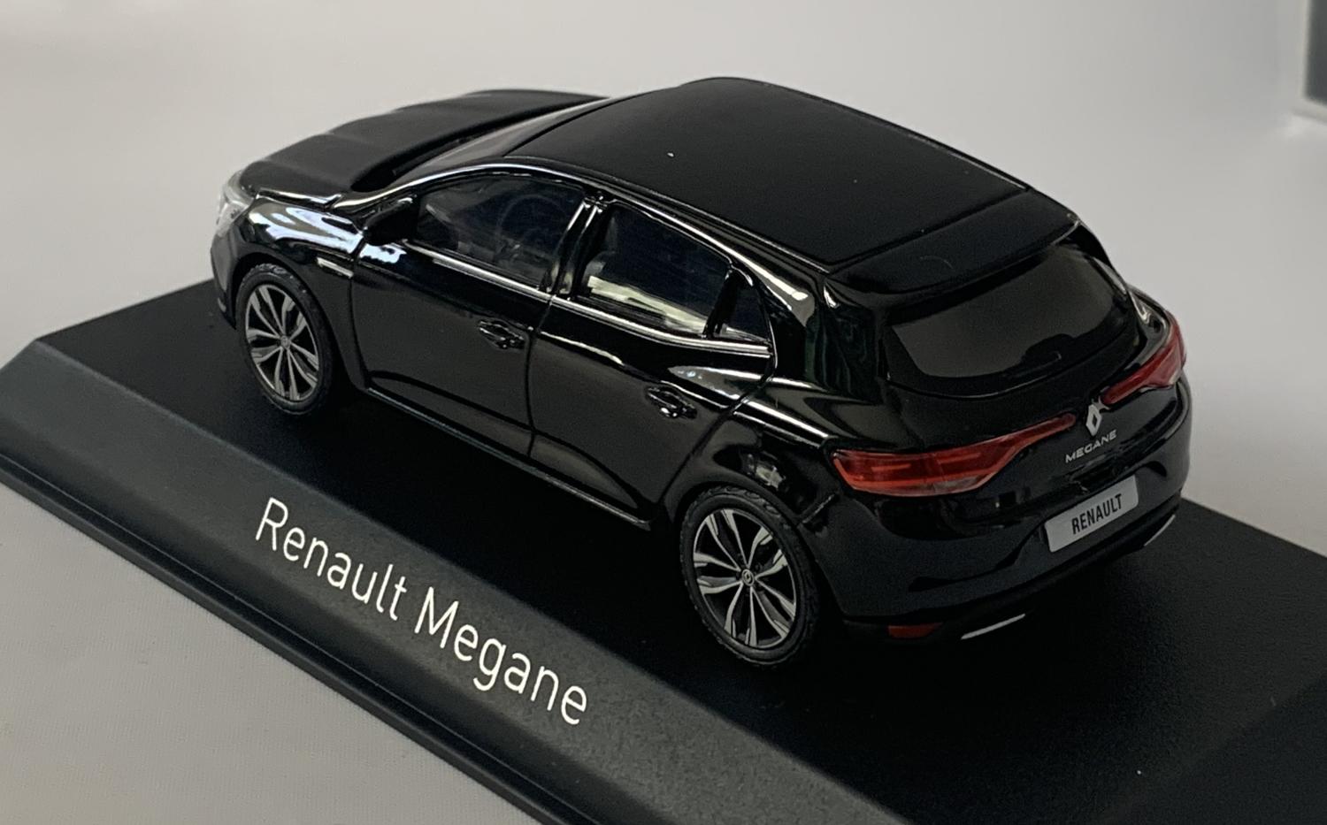 An excellent scale model of a Renault Megane decorated in black with roof top spoiler, tinted windows,