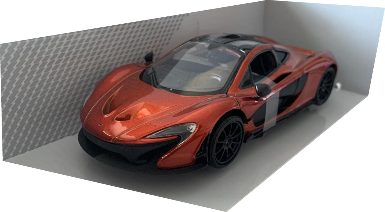 The McLaren P1 model is mounted on a removable plinth and presented in a window display box , the car is approx 18cm long