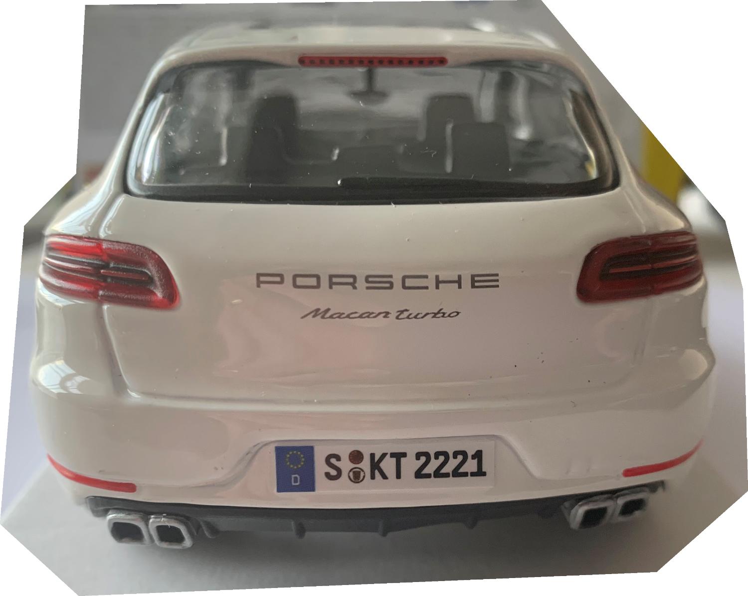 An excellent scale model of a Porsche Macan decorated in white