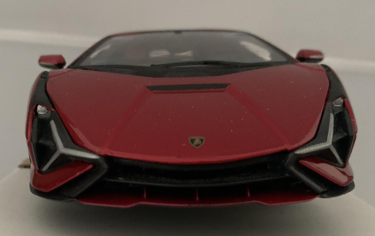 The Lamborghini Sian FKP 37 is decorated in metallic red with carbon effect trims and authentic graphics.