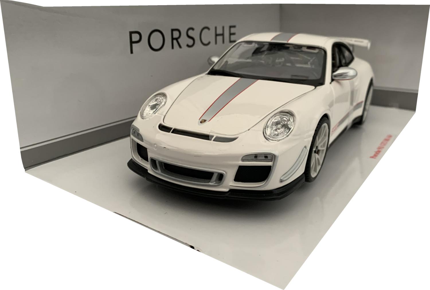 A very good representation of the Porsche 911 GT3 RS 4.0 decorated in white, silver and red strip graphics, matt silver door mirrors and white wheels
