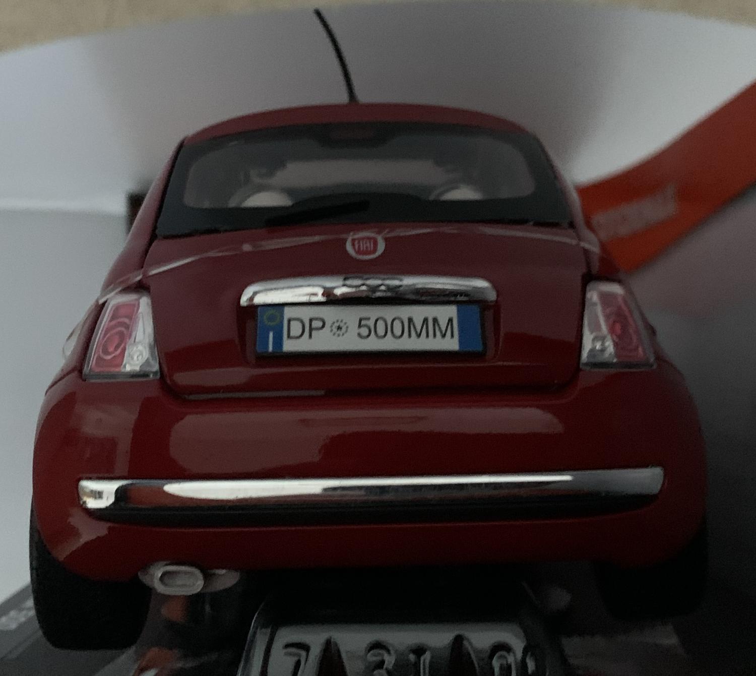 very good representation of the Fiat Nuova 500 decorated in red with silver wheel.