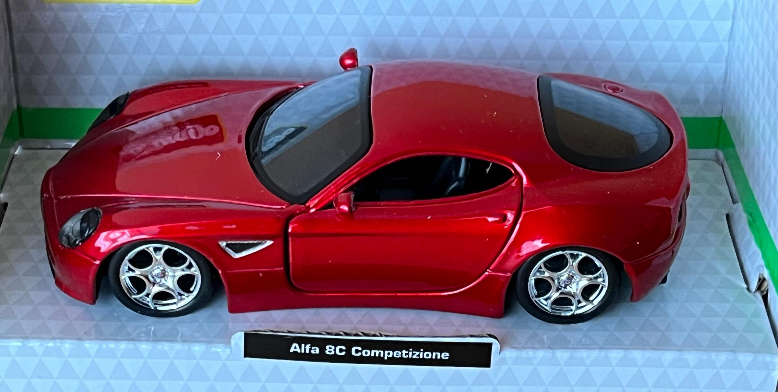 he Alfa 8C Competizione is decorated in metallic red with silver wheels.  Other trims are finished in black and silver.  Features include working wheels, opening driver and passenger doors.