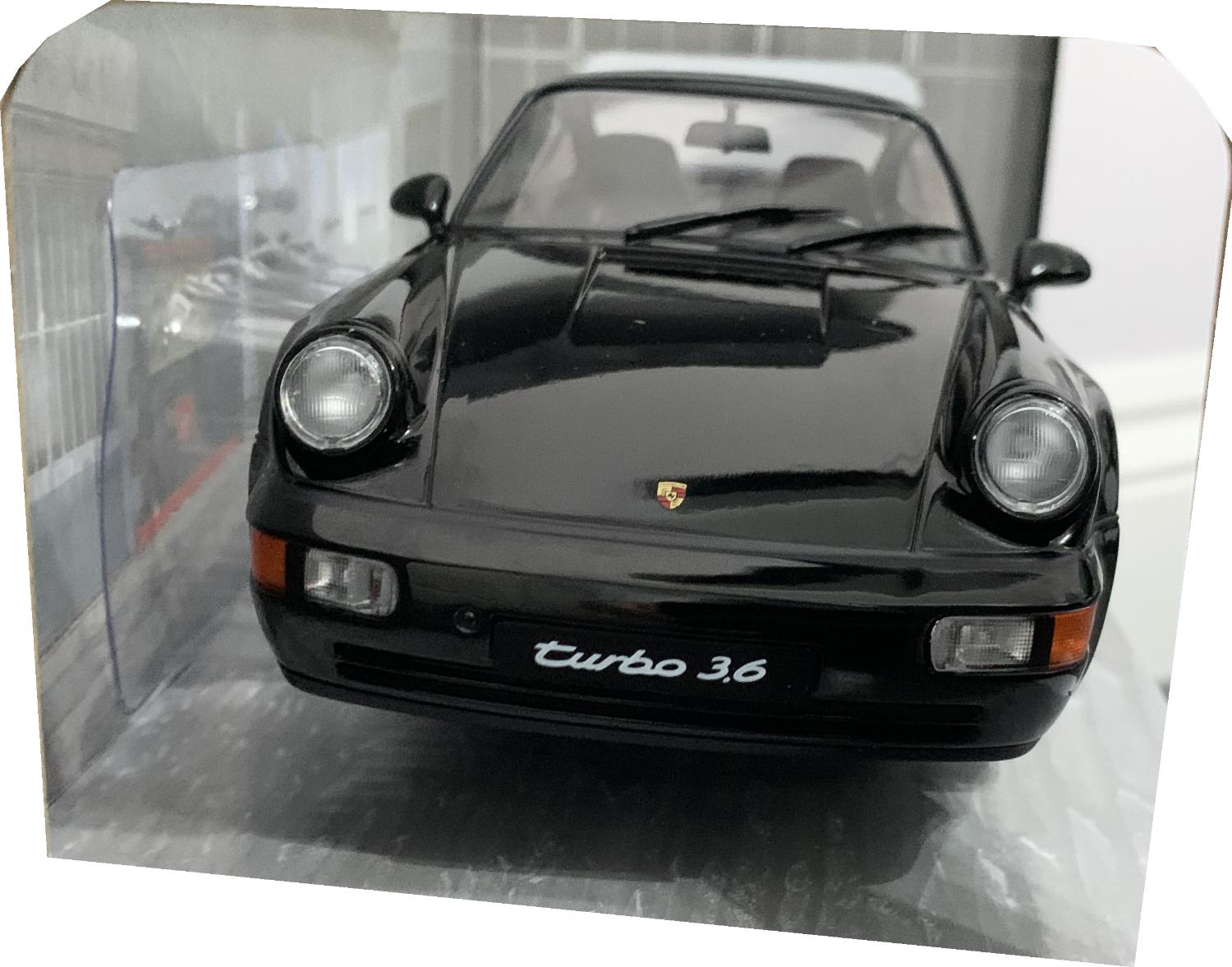 A very good representation of the Porsche 911 (964) Turbo decorated in black with rear spoiler, silver and chrome wheels.