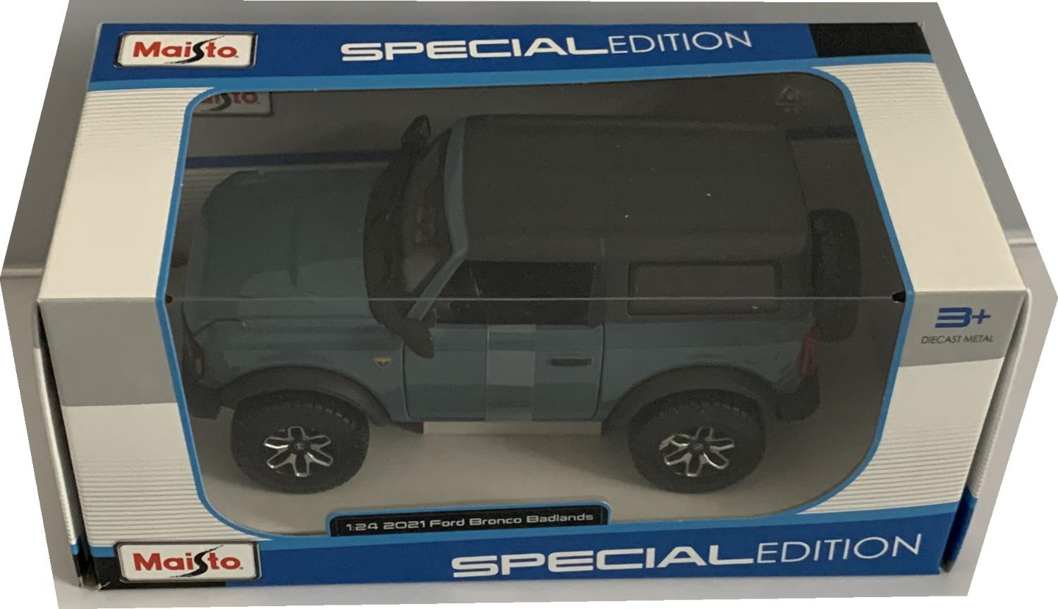 An excellent scale model of a Ford Bronco Badlands decorated in blue with black roof and silver and black wheels.