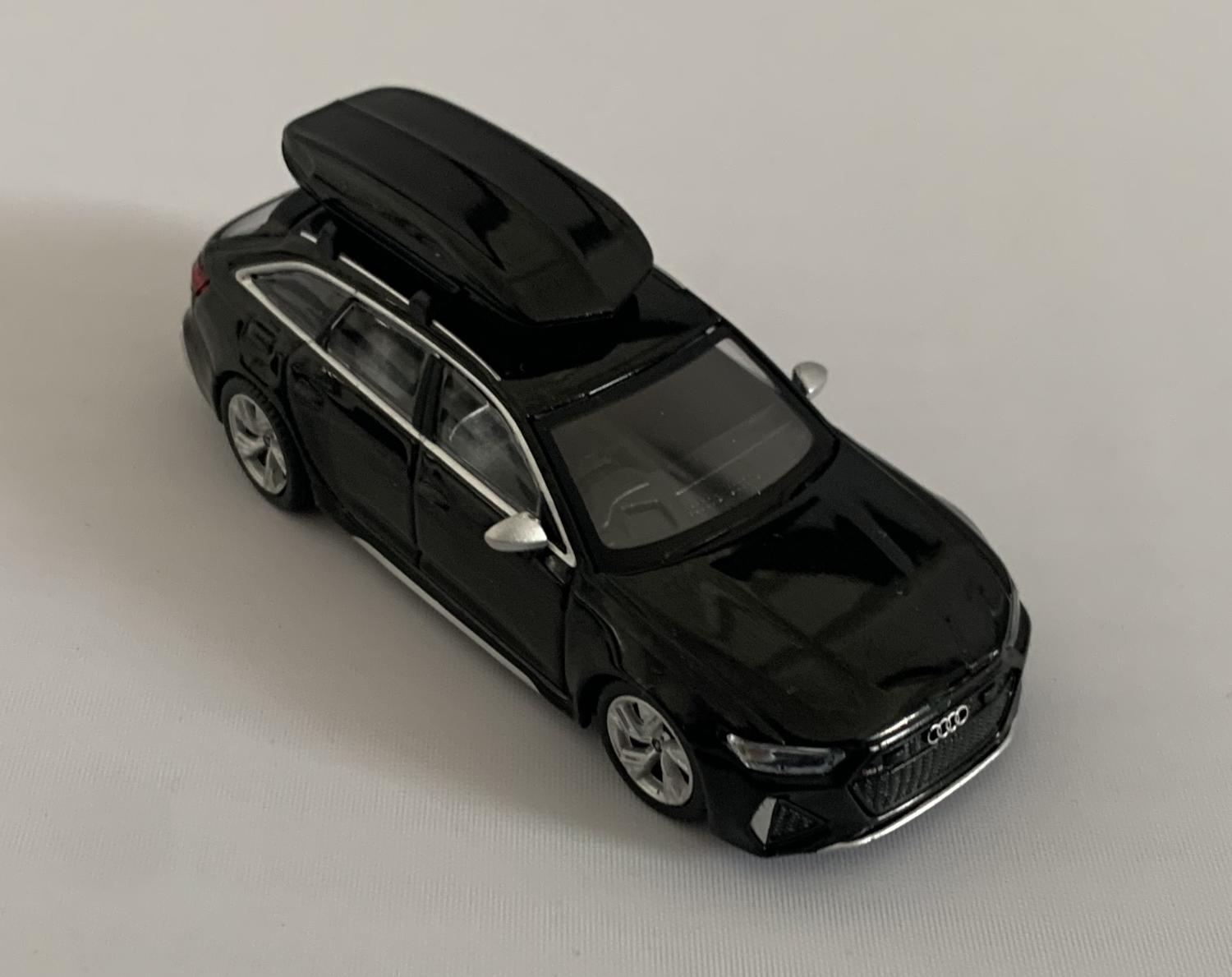 An excellent scale model of a Audi RS 6 Avant decorated in mythos black metallic with box roof and silver wheels.