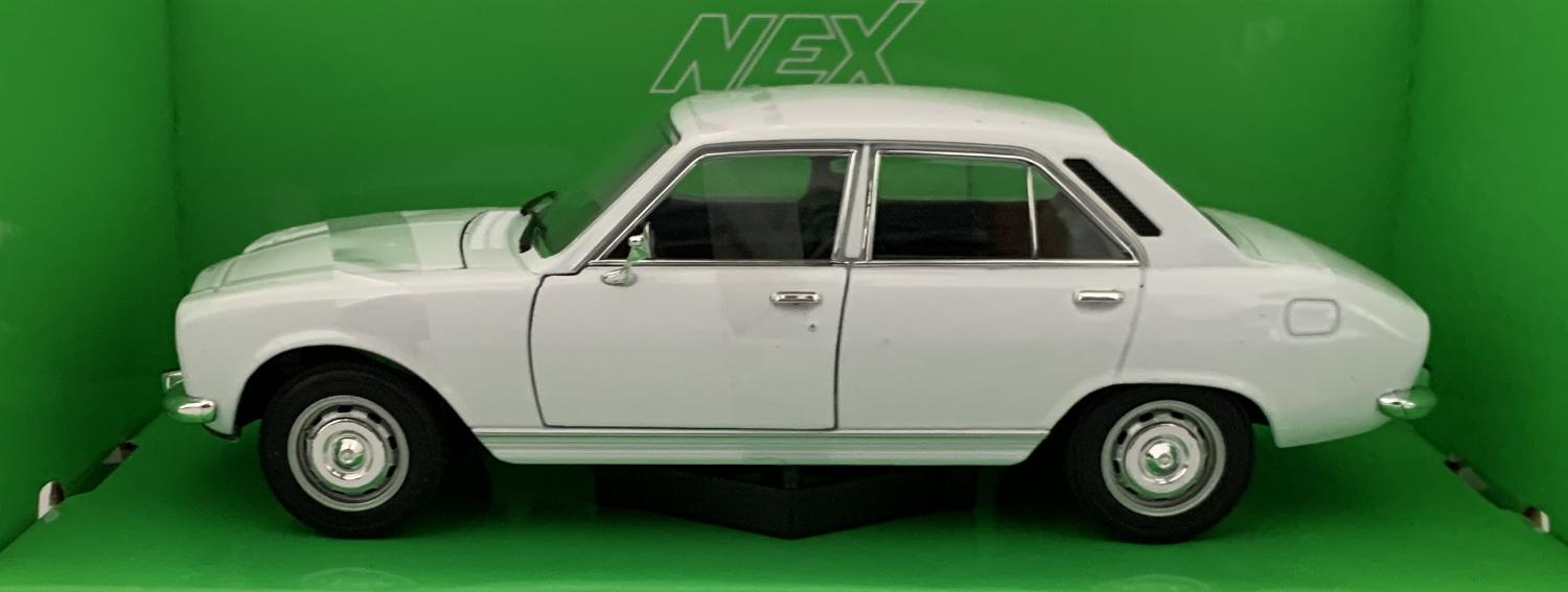 An excellent scale model of a Peugeot 504 saloon decorated in white with silver wheels. Other trims are finished in chrome, black and silver.  Features include opening driver and passenger doors, opening bonnet to reveal engine and working wheels