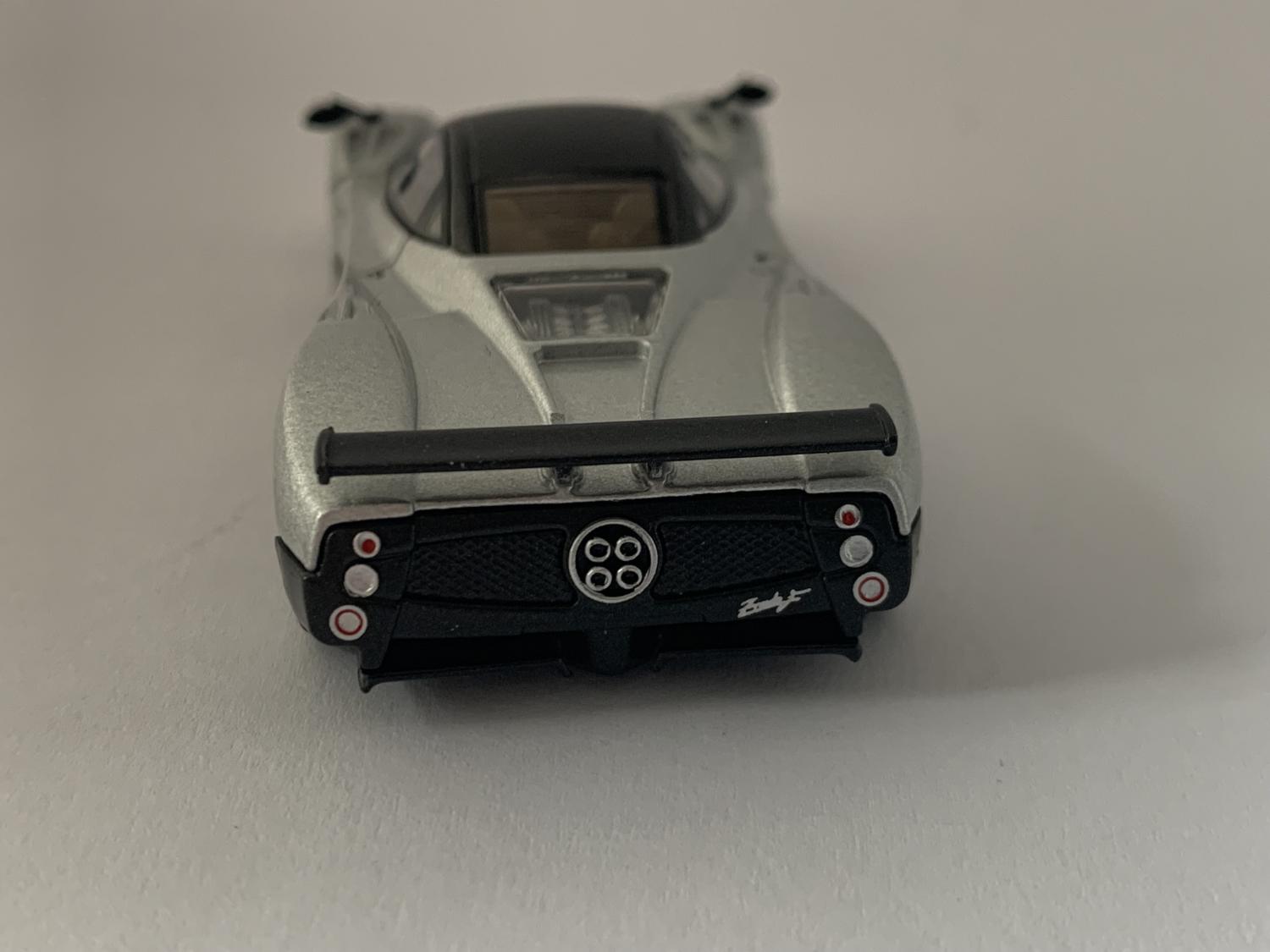 An excellent scale model of a Pagani Zonda F decorated in silver with high rear spoiler and silver wheels.