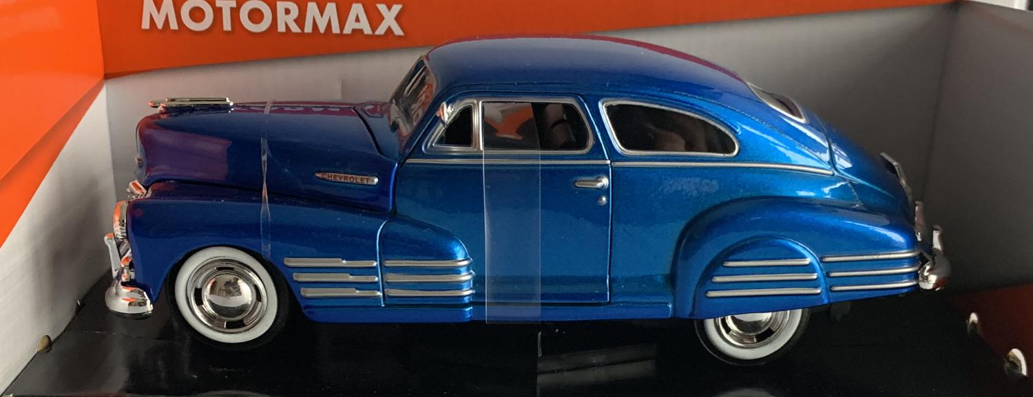 An excellent scale model of a Chevy Aerosdean Fleetline decorated in metallic blue with chrome wheels and white walled tyres.