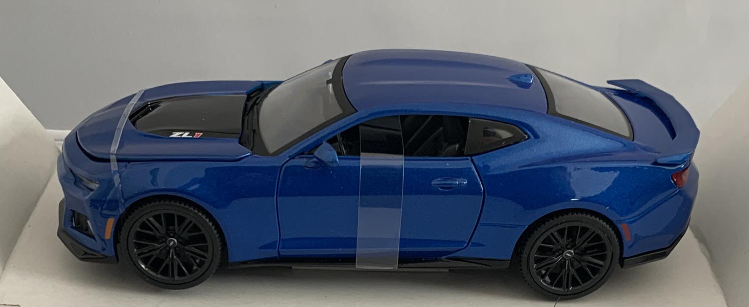 An excellent scale model of a Chevrolet Camaro ZL1 decorated in metallic blue with spoiler and black wheels. Other trims are finished in black.  Features include opening driver and passenger doors, opening bonnet to reveal engine
