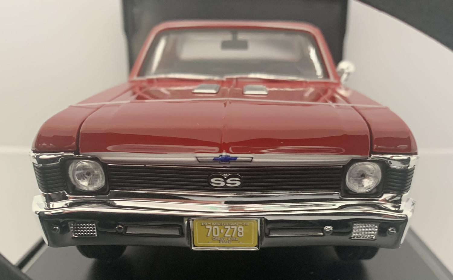 An excellent scale model of a Chevrolet Nova SS Coupe from 1970 decorated in red with bonnet air vents and chrome wheels.