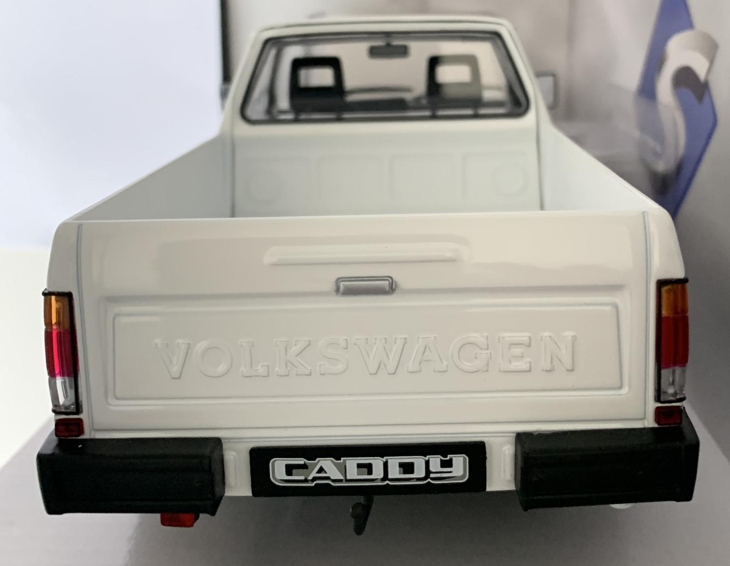 A very good representation of the VW Caddy pick up mk1 decorated in white with black trims and silver wheels