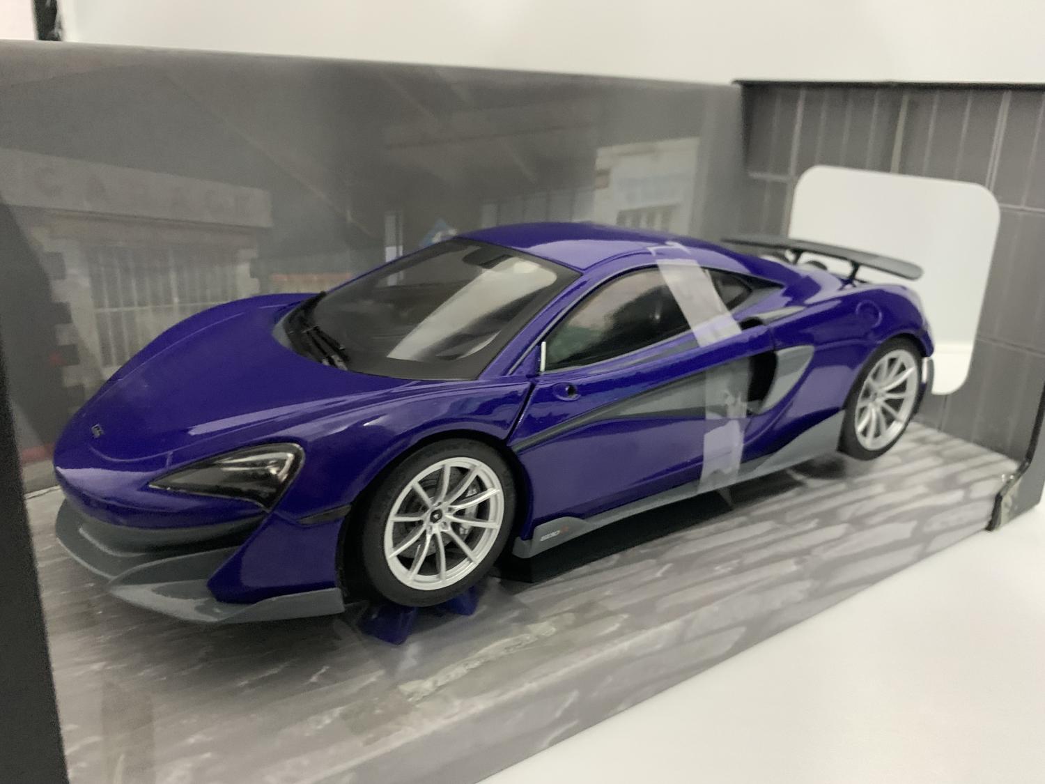 A very good representation of the McLaren 600LT decorated in lantana purple and grey with rear spoiler and silver wheels.
