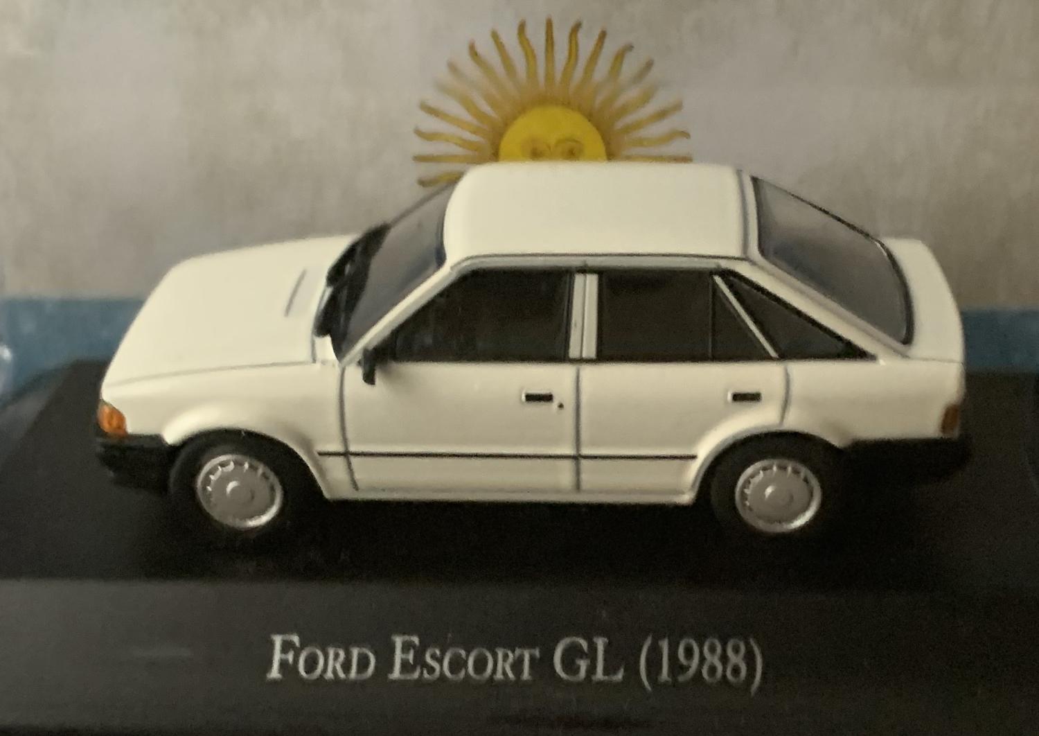 The model shown here is a good example of a Ford Escort GL from 1988 finished in white with black chassis and working wheels