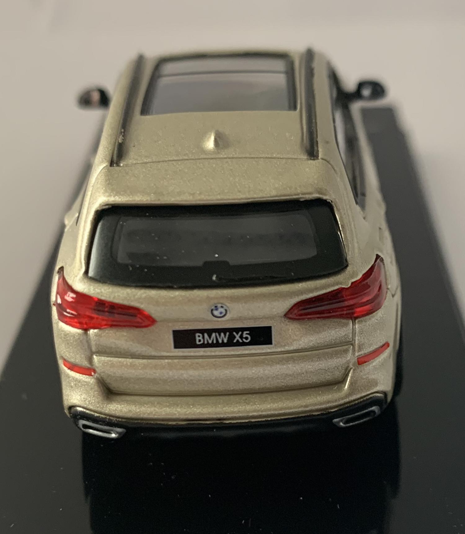 An excellent scale model of a 2018 BMW X5 decorated in sunstone metallic with panoramic roof, roof rails and silver wheels.  Other trims are finished in black and silve
