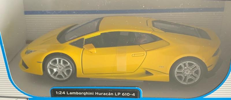 An excellent scale model of a Lamborghini Huracan LP 610-4 decorated in yellow with silver wheels.