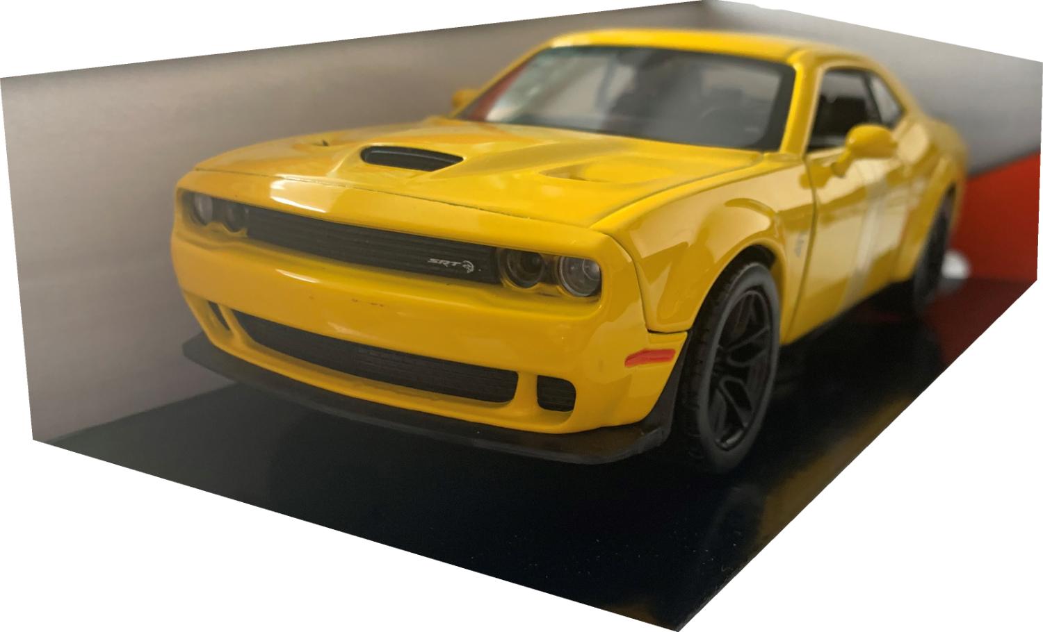 An excellent scale model of a Dodge Challenger SRT Hellcat Widebody decorated in yellow with rear spoiler and black wheels.