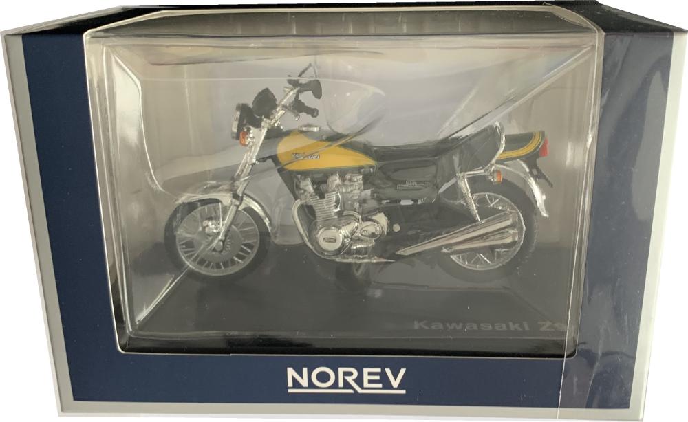 An accurate scale model of a 1973 Kawasaki Z900 decorated in dark green and yellow with authentic graphics and spike wheels.