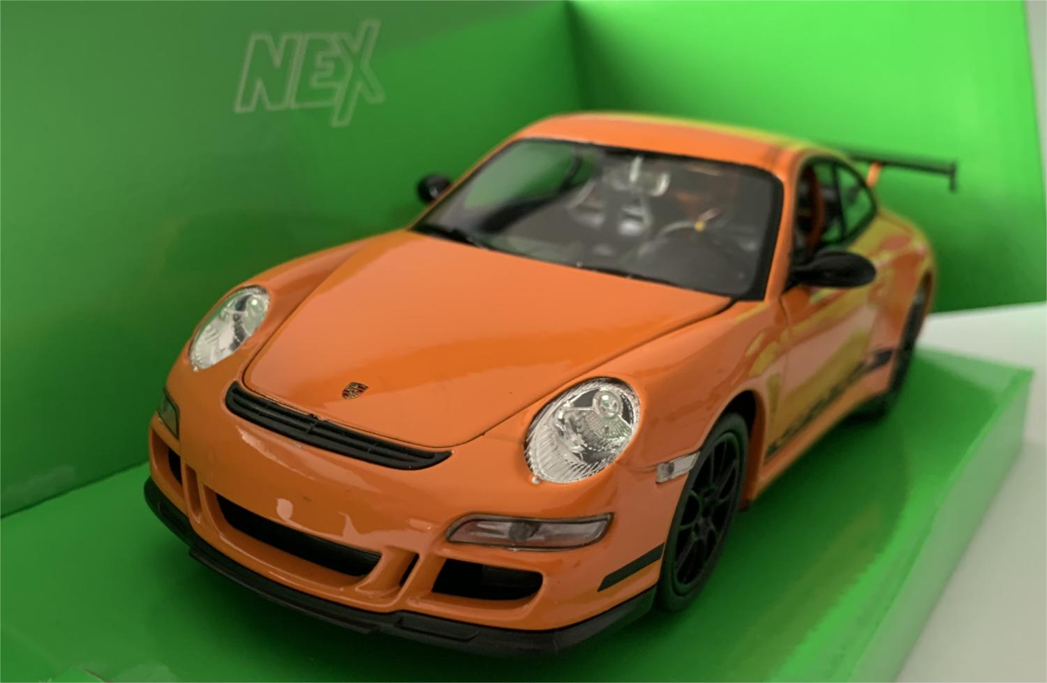 An excellent scale model of a Porsche 911 GTS RS decorated in orange with black spoiler, authentic graphics and black wheels