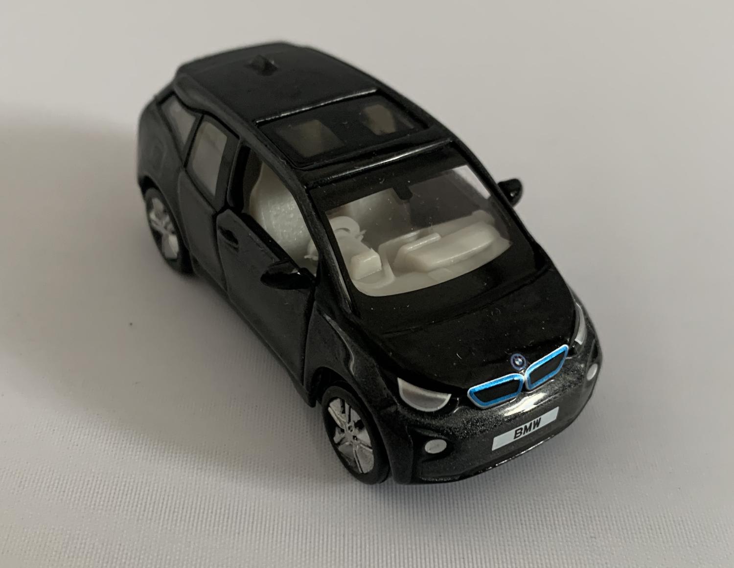 An excellent scale model of a BMW i3 decorated in mineral grey with sunroof and silver wheels
