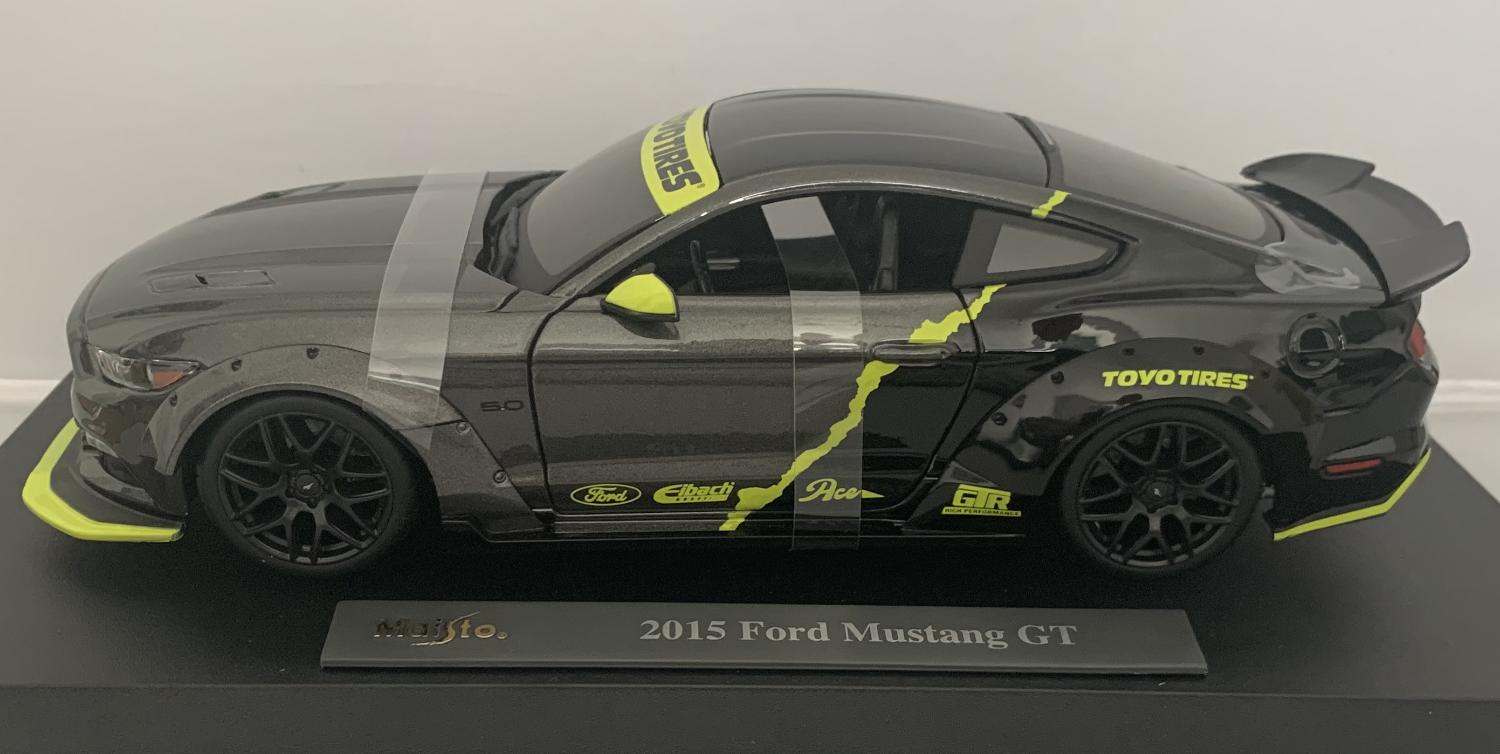 A very good representation of the Ford Mustang 5.0 GT decorated in dark grey and black roof with authentic graphics, spoiler and black wheels.
