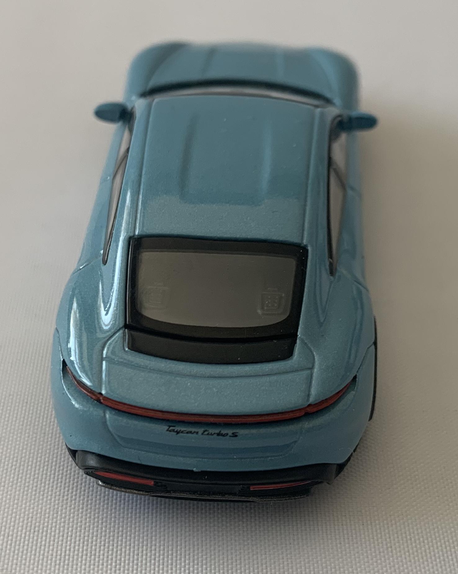 cated and sits on the front bonnet with the lettering Porsche Taycan Turbo S on the rear.  The Porsche badge also extends to the wheel hubs.  A good reproduction of the Porsche Taycan Turbo S with detail throughout, all authentically recreated. The model is presented in a box, the car is approx. 8 cm long and the box is 10 cm long
