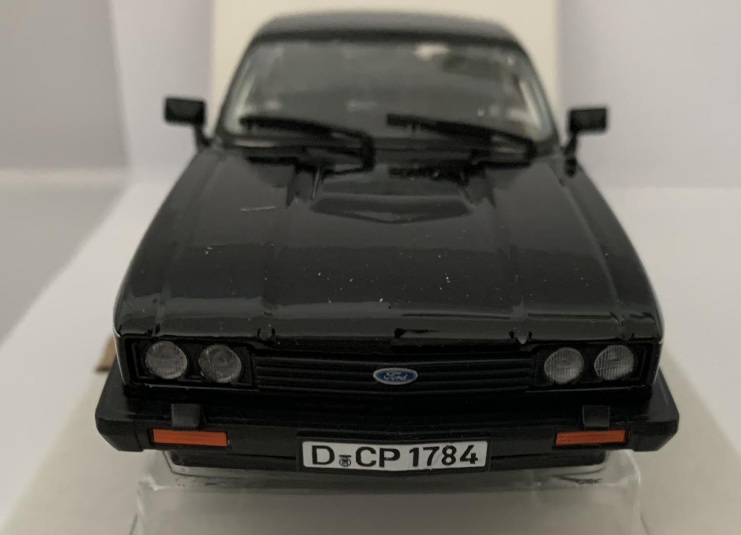 An excellent scale model of a Ford Capri 2.8 Injection decorated in black with authentic graphics, rear spoiler and silver wheels