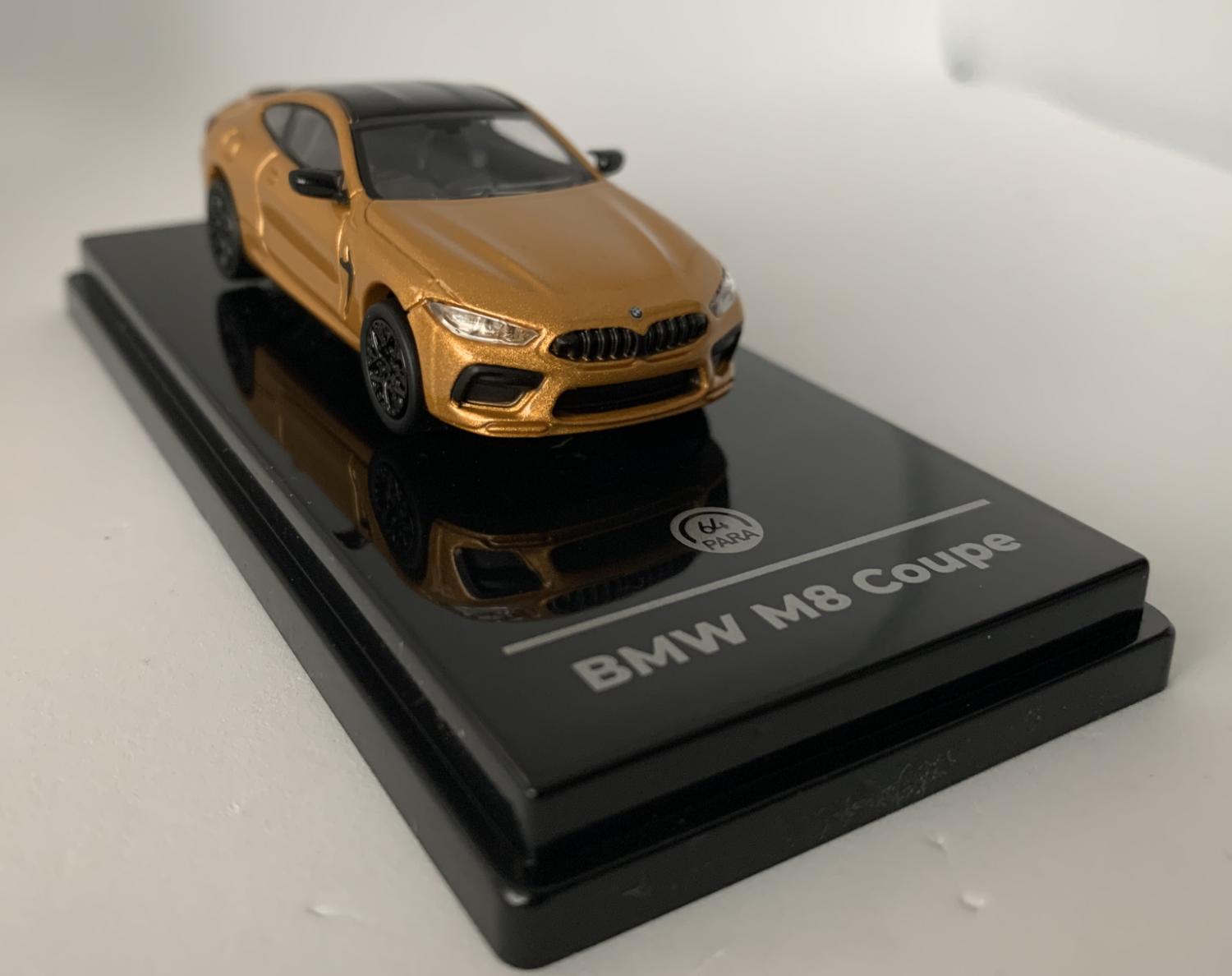 An excellent scale model of a BMW M8 Coupe decorated in ceylon gold