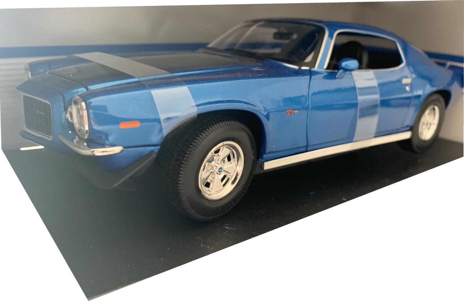 A very good representation of the Chevrolet Camaro Z/28 decorated in metallic blue with authentic black graphics, rear spoiler and chrome wheels.
